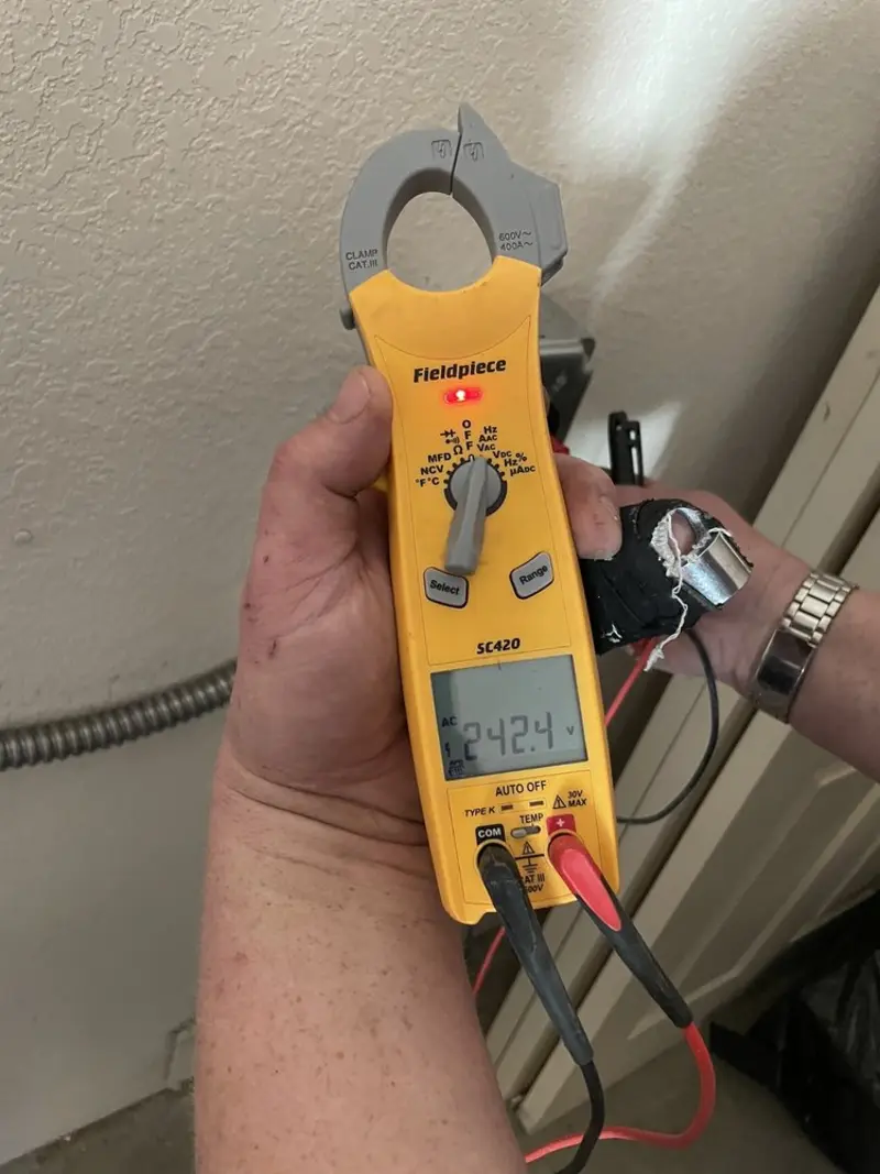 Voltage testing with clamp meter during Ceiling Fan Installation in Hidalgo